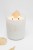 Zbliżenie zapalonej świecy Luméa Candle z cytrynem